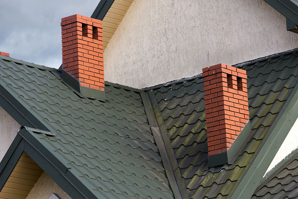 roofline with two brick chimneys